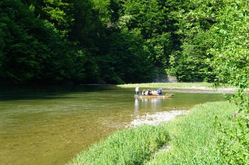 a group of people in a boat on a river at Rekreačna usadlosť Pieninka in Lesnica
