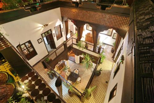 an overhead view of a living room with potted plants at Dar Najat in Marrakech