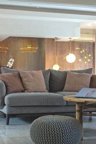 a living room with a couch and a table at Aristea Hotel in Rethymno Town