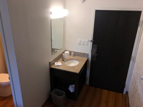 a bathroom with a sink and a mirror at Motel 6-La Crosse, WI in La Crosse