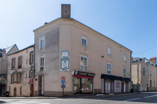 a building on the corner of a street at Le Félix Grat - LAVALOC in Laval