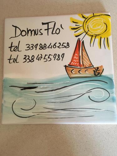 a birthday cake with a sail boat on it at Domus Flò in Santa Maria di Castellabate