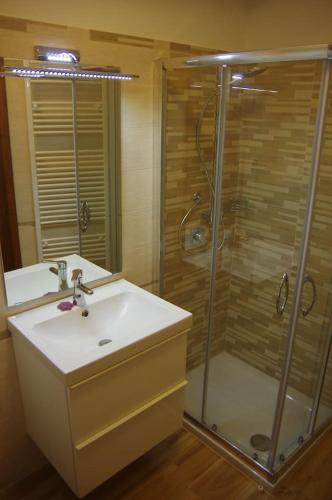 a bathroom with a sink and a shower at La Piccola Oasi Toscana in Bagni di Lucca