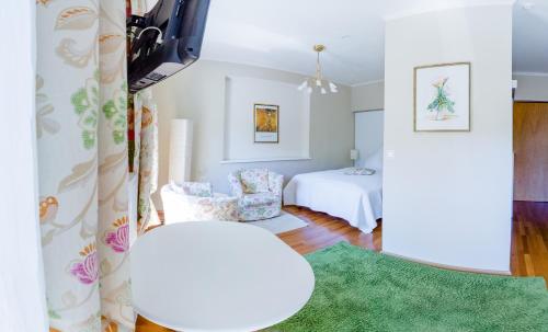 Ein Bett oder Betten in einem Zimmer der Unterkunft Hotel St. Hubertushof
