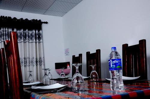 a bottle of water sitting on top of a table at Ceylon Resort in Wilpattu