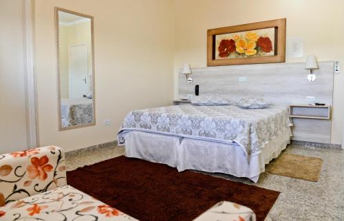 Voodi või voodid majutusasutuse Dmarco Hotel toas
