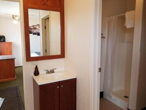 a bathroom with a sink and a mirror at 071A Private Studio near South Rim Sleeps 6- No Kitchen in Valle
