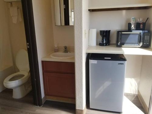 a small bathroom with a sink and a microwave at 068D Cozy Studio Grand Canyon South Rim Sleeps-2 in Valle