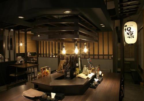 a restaurant with a table in the middle of a room at Yokote Plaza Hotel / Vacation STAY 40230 in Yokote