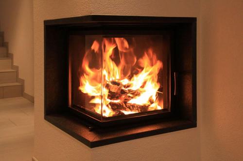 a fireplace with a fire inside of it at Apart Mount Everest in Sölden