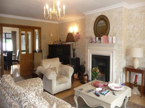 a living room with a couch and a table at Carrigshane House in Midleton