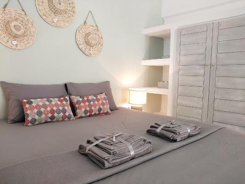a bedroom with two zebra pillows on a bed at STELLA MARINA in Panteli