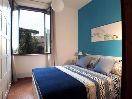 Кровать или кровати в номере Alloggio turistico La Casa del Vignola