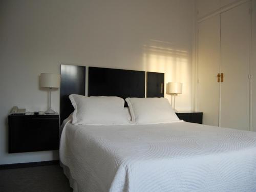 Posteľ alebo postele v izbe v ubytovaní Mercedes Rambla Hotel