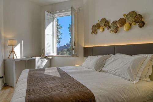 En eller flere senge i et værelse på Paradisea Taormina