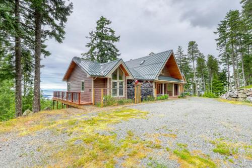 a house in the woods with a driveway at Sucia Island Mountain View in Eastsound