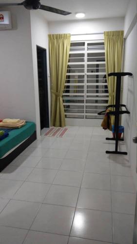 a living room with a couch and a chair at Spacious & Cozy Condo - Hijauan Heights Block C in Kajang