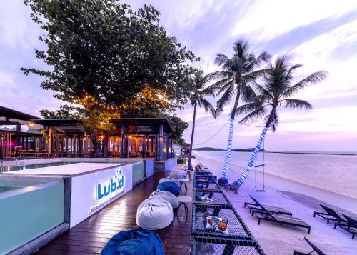 a restaurant on the beach next to the water at Lub d Koh Samui Chaweng Beach in Chaweng