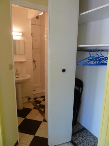 a bathroom with a toilet and a sink at Maison Baxter in Prats-de-Mollo-la-Preste