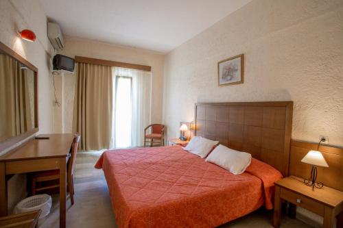 Ένα ή περισσότερα κρεβάτια σε δωμάτιο στο Popi Star Hotel
