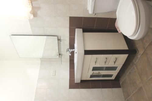 a bathroom with a sink and a toilet at Lost Horizon Beach Dive Resort in Panglao Island