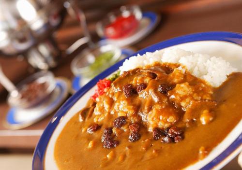 a plate of food with rice and curry at Hotel Sorriso Hamamatsu in Hamamatsu