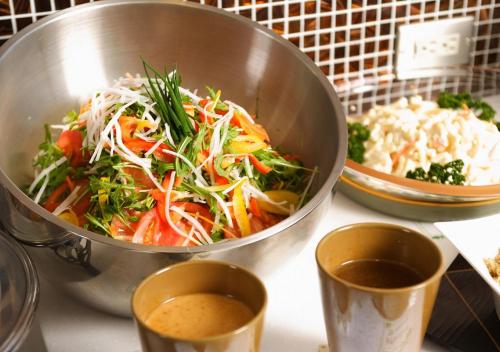 a bowl of food sitting on top of a counter at Hotel Sorriso Hamamatsu in Hamamatsu