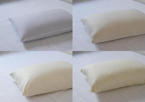 four different views of a pillow on a bed at Hotel Sorriso Hamamatsu in Hamamatsu