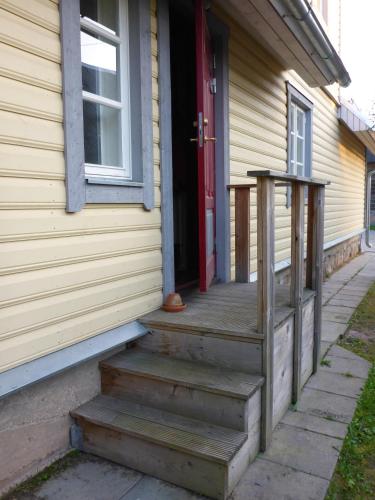 a front door of a house with a red door at Rosma Mill Holiday House in Põlva