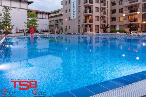 a large swimming pool in front of a building at TSB Sunny Victory in Sunny Beach