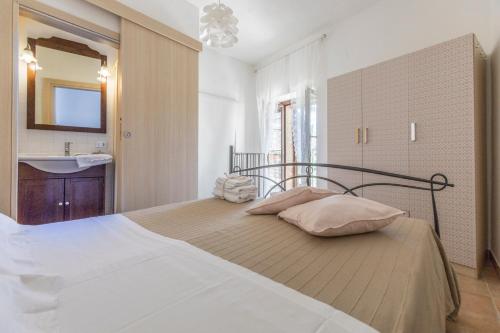Кровать или кровати в номере La casa in pietra