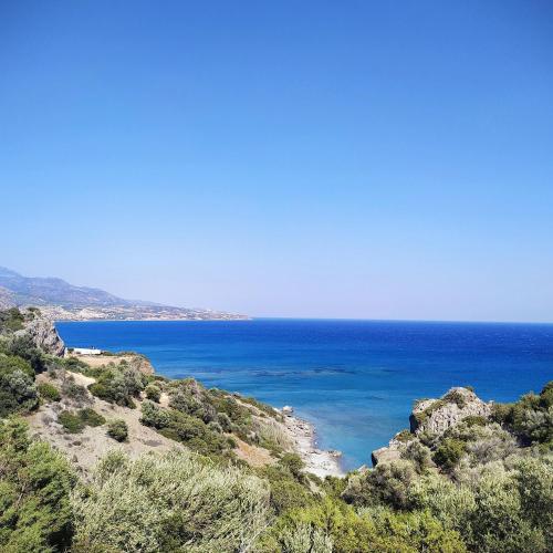 a view of the ocean from a hill at Orionas in Tsoútsouros