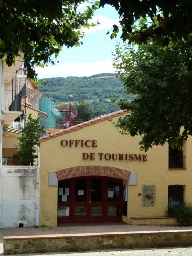 a building with the words office de torturer on it at Maison Baxter in Prats-de-Mollo-la-Preste