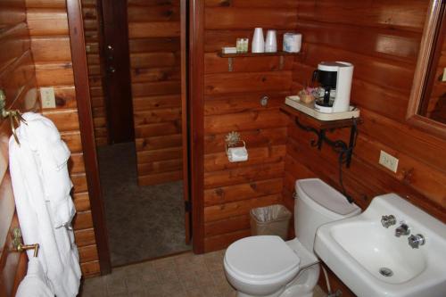 a bathroom with a toilet and a sink at Virginia Creek Settlement in Bridgeport