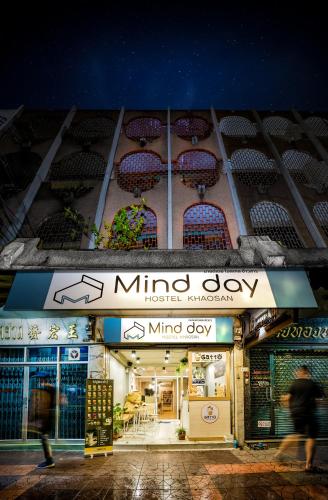 a building with a minnie day sign on it at Mind Day Hostel Khaosan in Bangkok