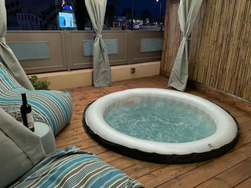 a large bath tub sitting in the middle of a patio at ARAD-DEAD SEA BASHIRIS PLACE in Arad