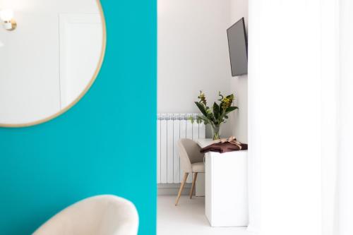 a room with a table and a mirror at Li Cetti in Lecce