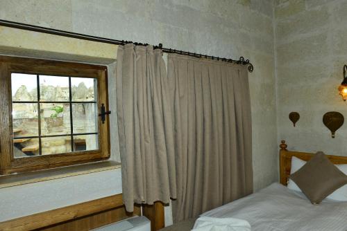 Cama o camas de una habitación en Caftan Cave Suites