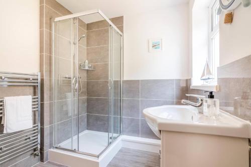 a bathroom with a shower and a sink at PLATFORM Port Area Apartment 1 in Hull