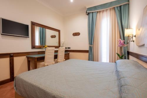 Hotel Michelangeloにあるベッド