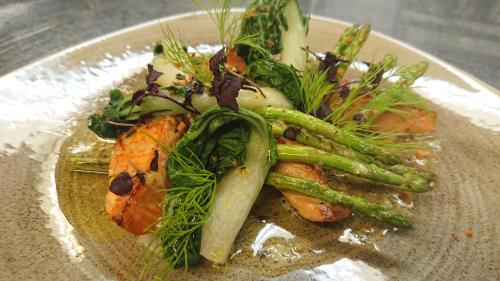 a plate of food with vegetables on a table at Hotel Madeleine in Obergurgl