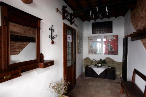 a room with a table and a mirror on the wall at Casina Della Burraia in Subbiano