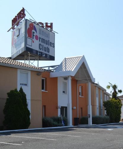 a building with a sign for the hotel miles club at Hôtel Formules Club in Cenon