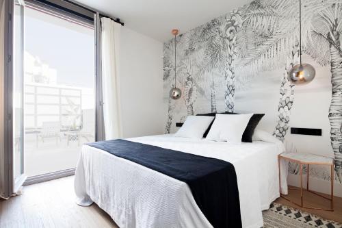 Un pat sau paturi într-o cameră la Casa Noa Apartments