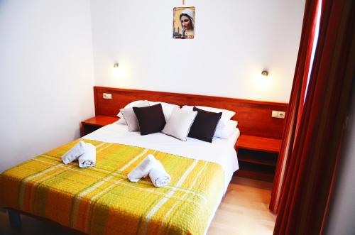 Ένα ή περισσότερα κρεβάτια σε δωμάτιο στο Hotel Quattro Medjugorje