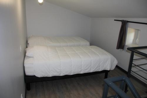 Ένα ή περισσότερα κρεβάτια σε δωμάτιο στο La Maison de Léobin