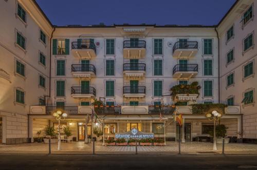 a large white building with a sign in front of it at Grande Albergo in Sestri Levante