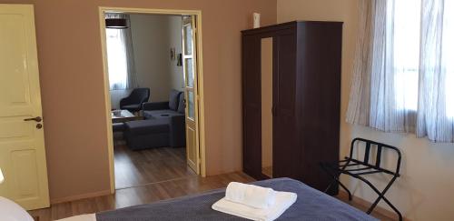 a bedroom with a bed and a living room at MA-GIA in Pastida