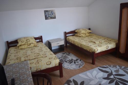 Giường trong phòng chung tại Vila Valentina