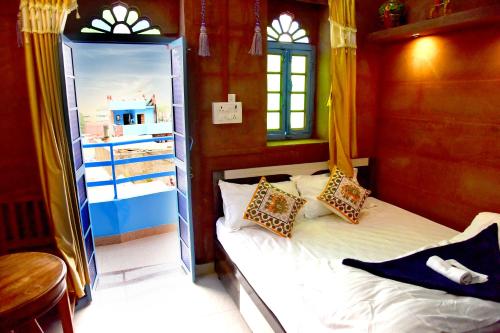 Una cama o camas en una habitación de MH Guest House